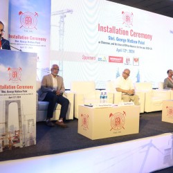 Professional corporate branding backdrop and stage installation by Kriti Events